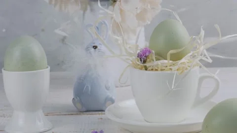 Easter table setting. Easter bunny and eggs. Fresh flowers. Close-up Stock Footage 169112636