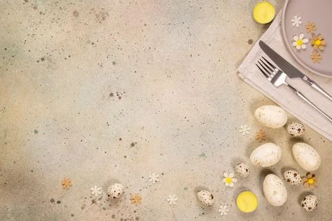 Easter table setting with eggs and flowers, top view Stock Photos