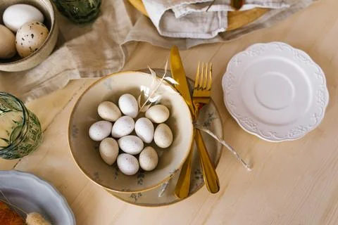 Easter table setting with eggs in a plate. Serving a festive breakfast or l.. Stock Photos