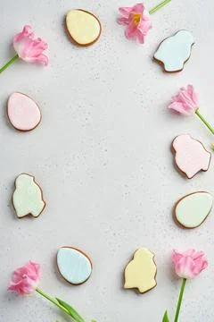 Easter table setting with floral decor and plate with easter gingerbread on w Stock Photos