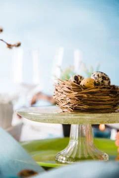 Easter table setting. Fresh eggs on plate. Spring table. Stock Photos