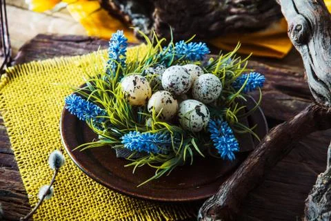 Easter table setting. Fresh eggs on plate. Spring table. Stock Photos