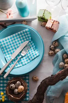 Easter table setting. Fresh eggs on plate. Spring table. Stock Photos