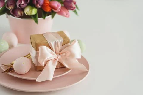 Easter Table Setting with Gift Box, Decorated Eggs and Tulips. Festive Spri.. Stock Photos