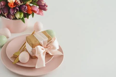 Easter Table Setting with Gift Box, Decorated Eggs and Tulips. Festive Spri.. Stock Photos