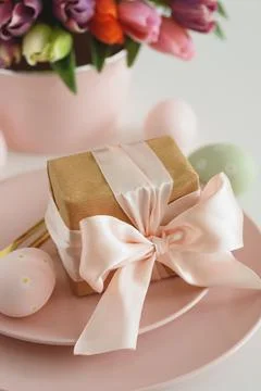 Easter Table Setting with Gift Box, Decorated Eggs and Tulips. Festive Spri.. Stock Photos