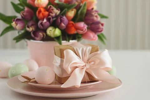 Easter Table Setting with Gift Box, Decorated Eggs and Tulips. Festive Spri.. Stock Photos