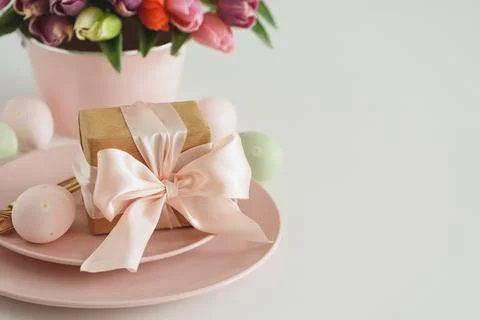 Easter Table Setting with Gift Box, Decorated Eggs and Tulips. Festive Spri.. Stock Photos