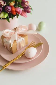 Easter Table Setting with Gift Box, Decorated Eggs and Tulips. Festive Spri.. Stock Photos