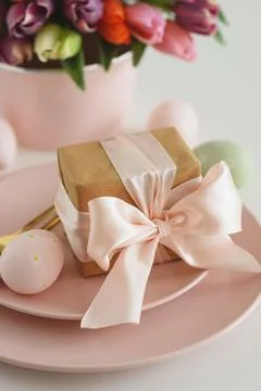 Easter Table Setting with Gift Box, Decorated Eggs and Tulips. Festive Spri.. Stock Photos