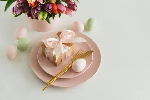 Easter Table Setting with Gift Box, Decorated Eggs and Tulips. Festive Spri.. Stock Photos