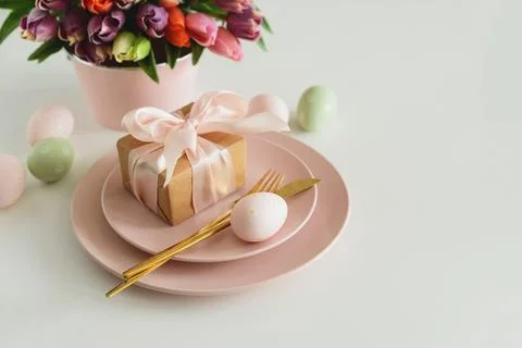 Easter Table Setting with Gift Box, Decorated Eggs and Tulips. Festive Spri.. Stock Photos