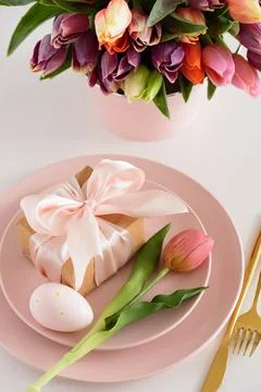 Easter Table Setting with Gift Box, Decorated Eggs and Tulips. Festive Spri.. Stock Photos