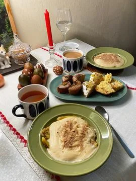 Easter table setting with kulich, candle and painted eggs Stock Photos