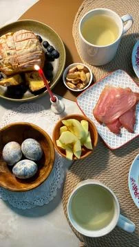 Easter table setting with kulich, candle and painted eggs, top view Stock Photos