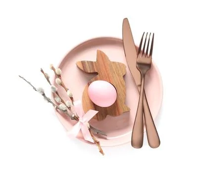 Easter table setting with pussy willow branches, wooden holder and painted eg Stock Photos