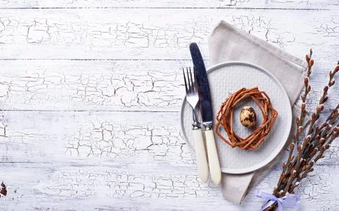 Easter table setting with quail eggs Stock Photos