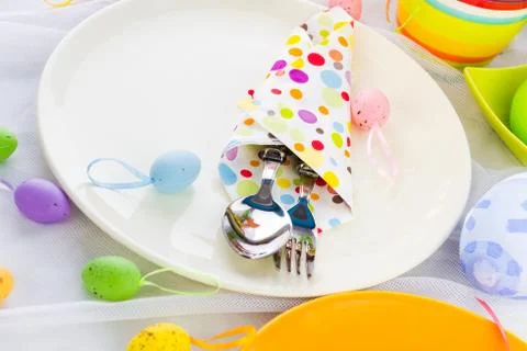 Easter table setting silverware wrapped napkin Stock Photos
