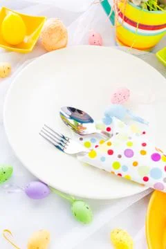 Easter table setting silverware wrapped napkin Stock Photos