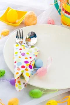 Easter table setting silverware wrapped napkin Stock Photos