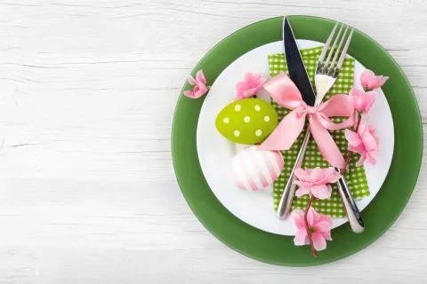 Easter table setting with spring flowers and cutlery. Stock Photos