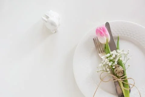 Easter table setting with tulip. Spring dinner. Stock Photos