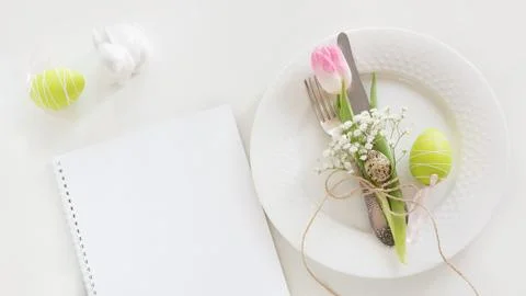Easter table setting with tulip. Spring dinner. Stock Photos