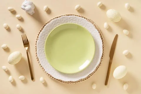 Easter table setting with white plate, cookies , eggs and bunny Stock Photos