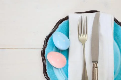Easter table setting on white wooden background. Top view, space for text Stock Photos