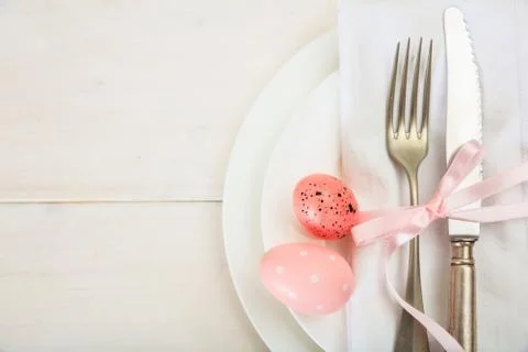 Easter table setting on white wooden background. Top view, space for text Stock Photos