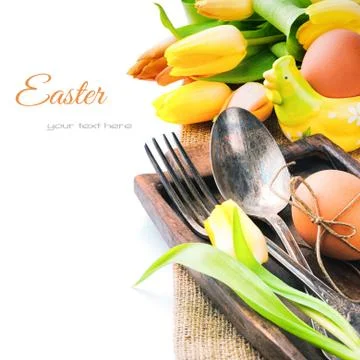 Easter table setting with yellow tulips Stock Photos