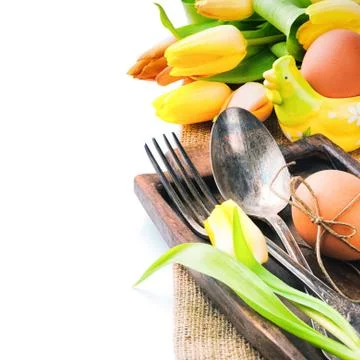 Easter table setting with yellow tulips Stock Photos