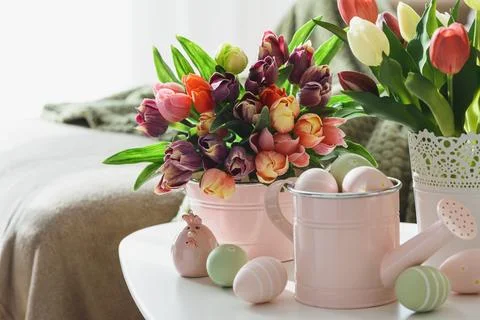 Easter Table with Tulip Bouquets, Eggs and Festive Decor. Cozy Spring Arran.. Stock Photos