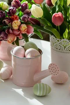 Easter Table with Tulip Bouquets, Eggs and Festive Decor. Cozy Spring Arran.. Stock Photos