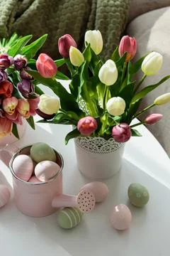Easter Table with Tulip Bouquets, Eggs and Festive Decor. Cozy Spring Arran.. Stock Photos