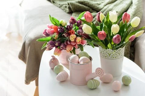 Easter Table with Tulip Bouquets, Eggs and Festive Decor. Cozy Spring Arran.. Stock Photos