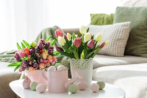 Easter Table with Tulip Bouquets, Eggs and Festive Decor. Cozy Spring Arran.. Stock Photos