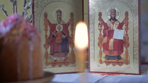 Easter table with willow, candle and icon Stock Footage 129429975