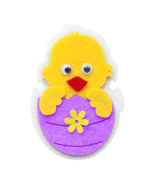Easter theme, decorative chicken in decorative purple felt Easter egg Stock Photos