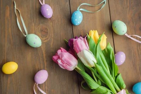 Easter traditional objects isolated on dark wooden background colorful eggs and Stock Photos