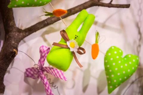 Easter tree decorated with soft toys in the form of rabbits of hearts and egg Stock Photos