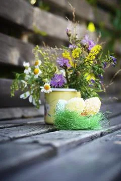 Easter vertical concept with Easter eggs and spring flowers with copy space. Stock Photos