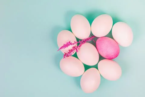 Easter. White eggs with red, on a uniform blue background. Stock Photos