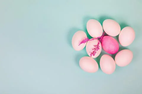 Easter. White eggs with red, on a uniform blue background. Stock Photos
