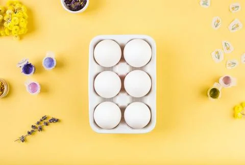 Easter white eggs on yellow background prepared for decoration. Minimal happy Stock Photos