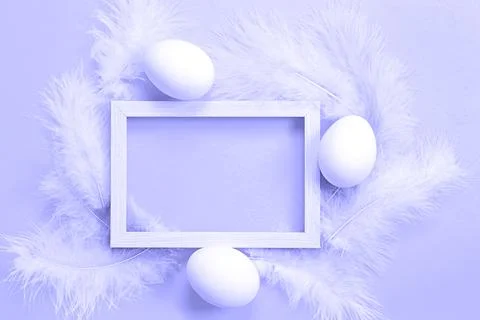 Easter white frame on purple background very peri tinting of chicken eggs a.. Stock Photos
