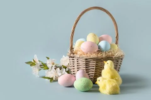 Easter wicker basket with pastel eggs for Happy holiday and celebration . Stock Photos