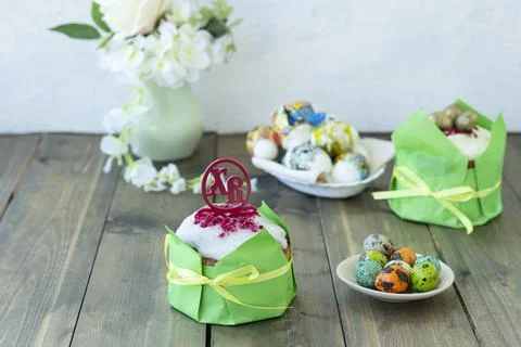Easter wooden table with Easter cakes and colored eggs. topper with Russian l Stock Photos