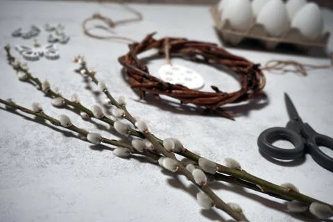 The easter wreath from branches vines with thread on grey background with c.. Stock Photos