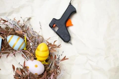 Easter wreath hand made. Colored Eggs and Chickens Home Decoration Glue Gun DIY Stock Photos